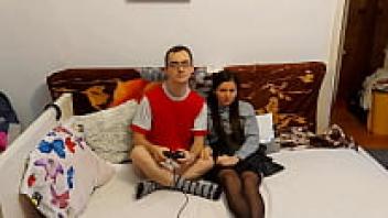 A lustful college student I interrupt my brother's video game while we are alone at home and give him a firm hug.