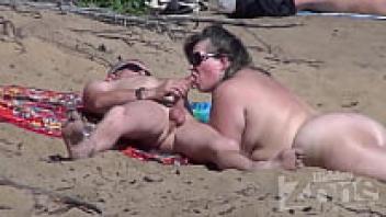 On a nudist beach, blowjob
