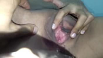 The maid rubs her clit while playing with his cock.