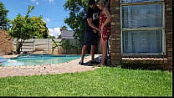 Standing outside and giving my neighbor's wife a hand with her swimming pool