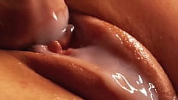 Gorgeous pussy smeared with cum and lubrication. Close-up