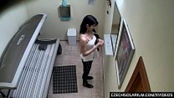 A fashionable adolescent girl rubbing her pussy