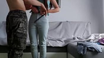 On the sofa, a teenage couple engages in passionate sex.
