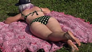 A voyeur in the woods is watching a female use a squirt to masturbate in order to have an orgasm. Hairy pussy and big ass.